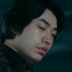 The henchman is portrayed by a Korean actor.
