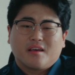Officer Lee is portrayed by a Korean actor.