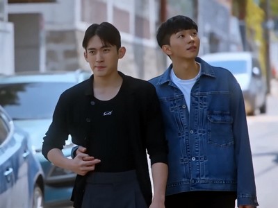 Wootae and Iseop hold hands.